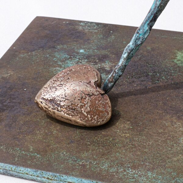 Bronze heart and staff detail on steel base by JJ Walker