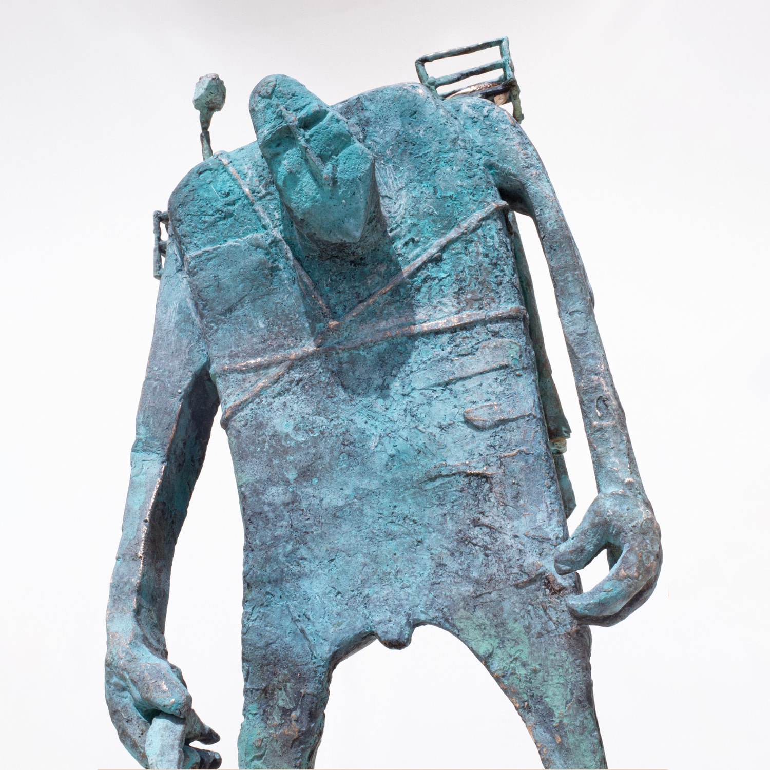 Bronze figure with staff and hand cast hearts. Front view. Copyright JJ Walker 2023